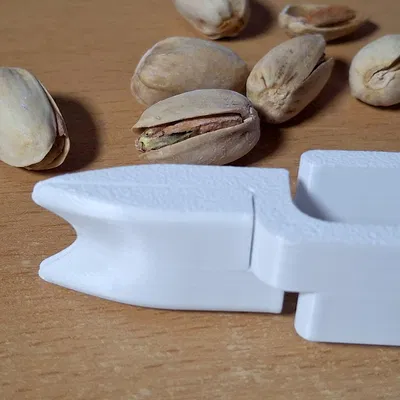 Pistachionator - Dụng cụ mở hạt dẻ cười (pistachio opener)