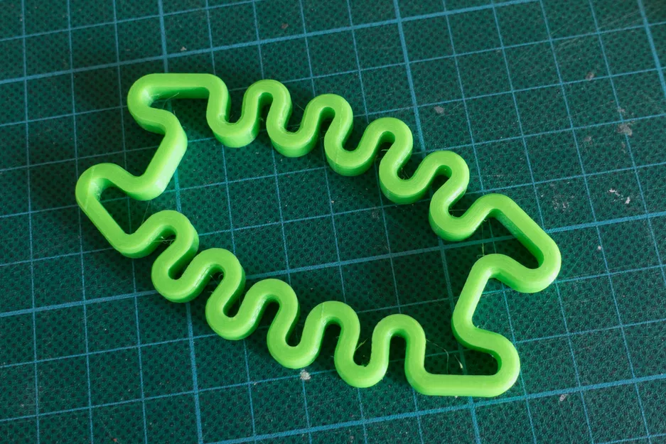 Giá quấn dây tai nghe Squished Bug (springy) - Image 1