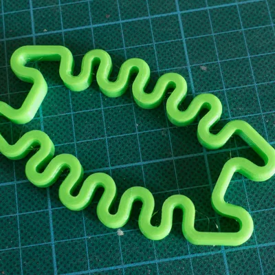 Giá quấn dây tai nghe Squished Bug (springy)