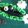Giá quấn dây tai nghe Squished Bug (springy) - Thumbnail 2