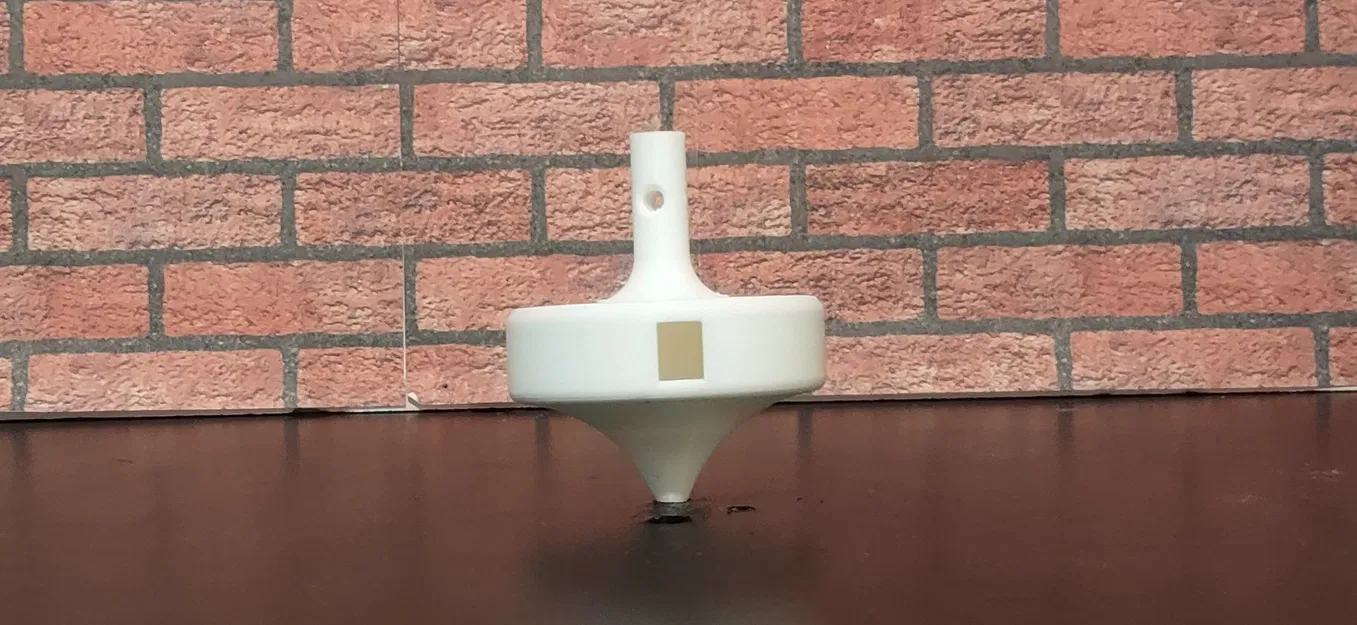 Con quay phát âm lớn khi quay (Loud Tone Generating Spinning Top) - Image 1