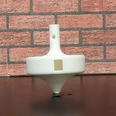 Con quay phát âm lớn khi quay (Loud Tone Generating Spinning Top)