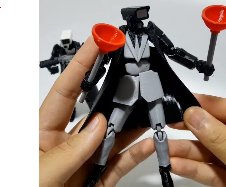 Mô Hình Camara Man Skibidi Toilet Có Phụ Kiện Thông Tắc Bồn Cầu - Image 1