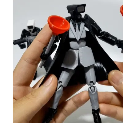 Mô Hình Camara Man Skibidi Toilet Có Phụ Kiện Thông Tắc Bồn Cầu