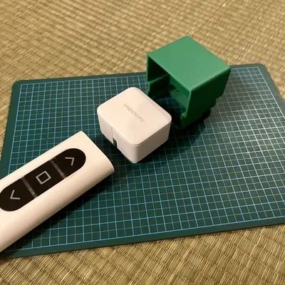 Adapter gắn SwitchBot BOT cho remote cửa cuốn YKK AP