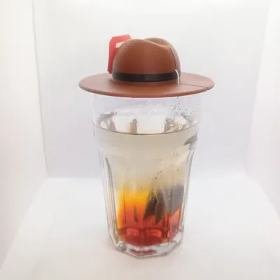 TeaHat: Nắp đậy ly trà hình chiếc mũ giữ nhiệt và giữ dây túi lọc