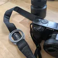 Giá đỡ nắp ống kính máy ảnh (Camera Lens Cap Holder) - Thumbnail 1