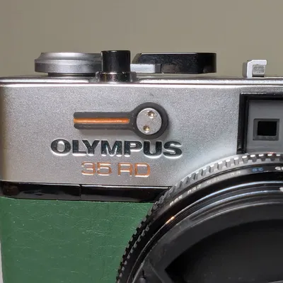 Cần gạt hẹn giờ (Self-timer lever) cho máy ảnh Olympus 35 RD