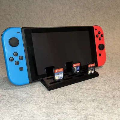 Đế dựng Nintendo Switch và khay đựng 11 băng game tiện lợi