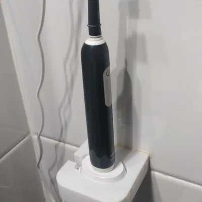 Giá treo tường tích hợp sạc cho bàn chải điện Oral B