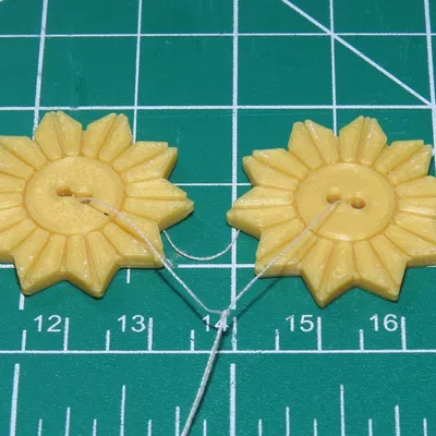 Cúc áo hình mặt trời (Sun Button)