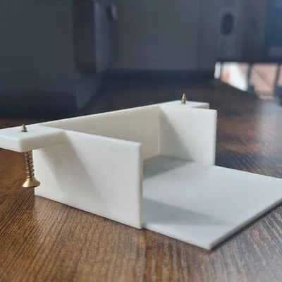 Giá đỡ cục sạc Macbook treo tường gọn gàng cho bàn làm việc