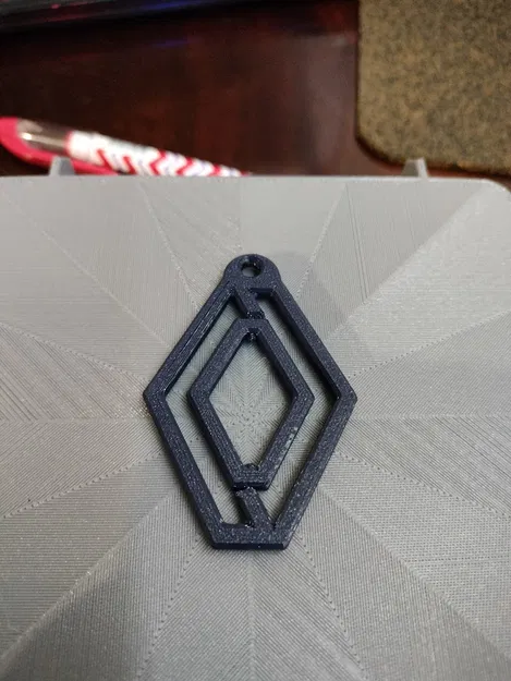 Móc khóa logo Renault xoay độc đáo cho tín đồ đam mê xe hơi - Image 1