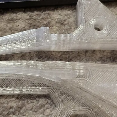 Lẫy kéo hỗ trợ nạp sợi nhựa cho hộp MMU Buffer, có thêm gờ dẫn hướng