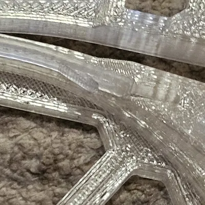 Lẫy kéo hỗ trợ nạp sợi nhựa cho hộp MMU Buffer, có thêm gờ dẫn hướng