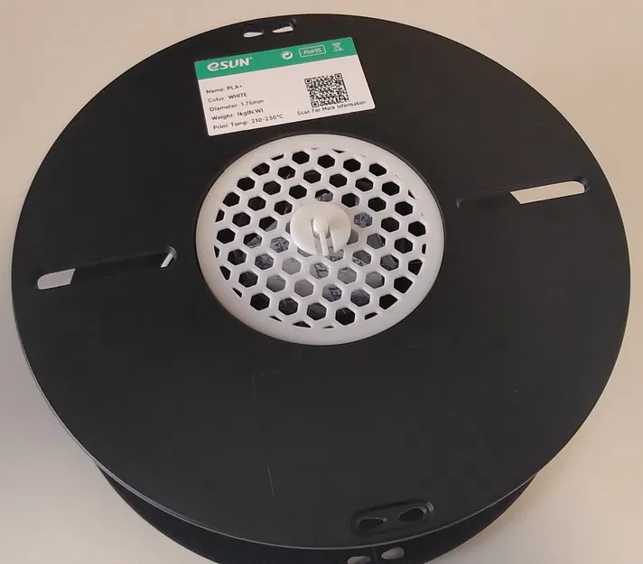 Bộ giá đỡ túi hút ẩm đặt trong cuộn nhựa (In-spool desiccant bag holder) - Image 1