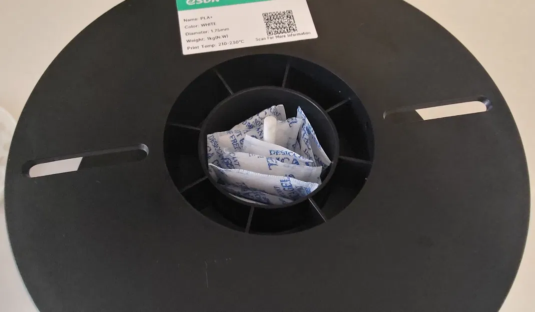 Bộ giá đỡ túi hút ẩm đặt trong cuộn nhựa (In-spool desiccant bag holder) - Image 3