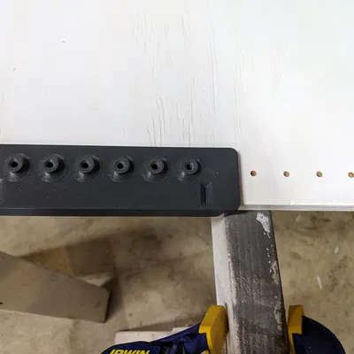 Cữ khoan (Drill Jig) dùng cho chốt đỡ kệ điều chỉnh