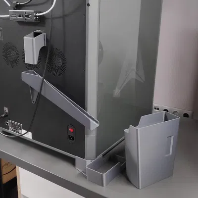 K2 Plus - Máng chứa rác thải bên trái kèm thùng có thể tháo rời