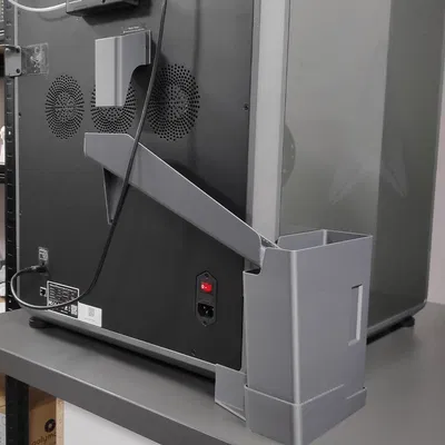 K2 Plus - Máng chứa rác thải bên trái kèm thùng có thể tháo rời