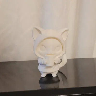 Chú mèo cùng tách cà phê