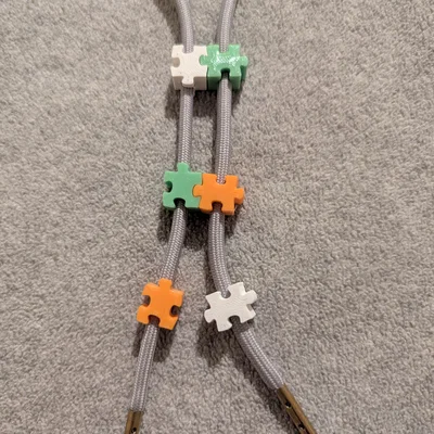 Kẹp dây áo hoodie hình mảnh ghép (Jigsaw Hoodie Beads) độc đáo