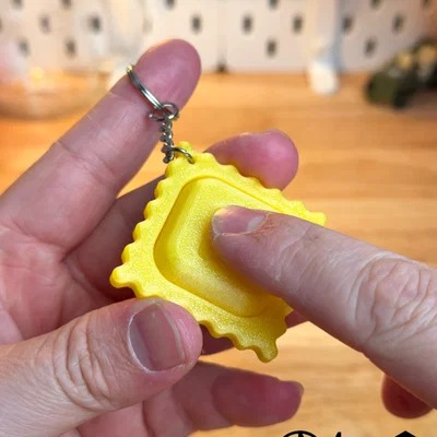 Móc khóa giảm stress hình bánh Ravioli Clicker độc đáo