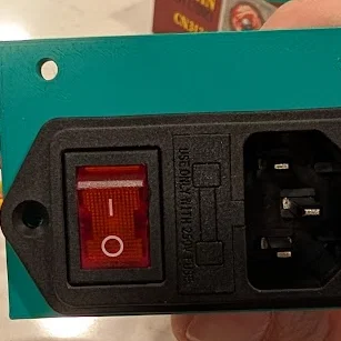 Giá đỡ ổ cắm nguồn có công tắc cho máy in Rook MK2