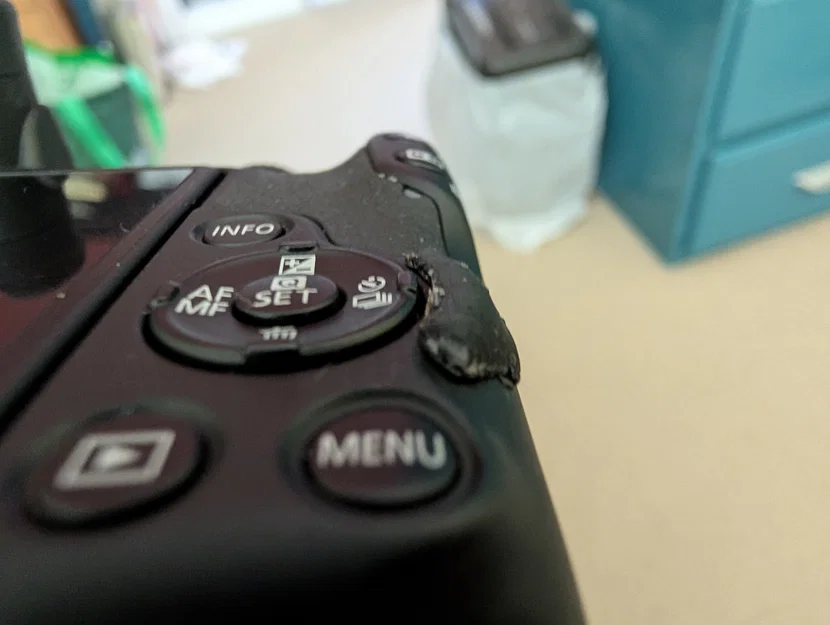 Miếng chắn nút Drive Mode cho Canon R50 - Image 1