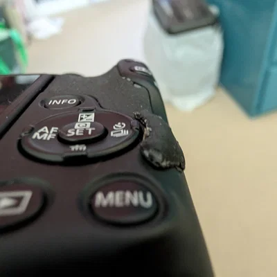 Miếng chắn nút Drive Mode cho Canon R50