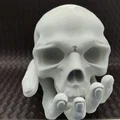 Skull in Hand - Ống heo/Heo đất hình đầu lâu trên bàn tay - Thumbnail 1