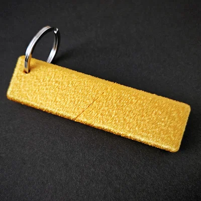 Móc khóa hình thanh cá tẩm bột (Fish finger keychain)
