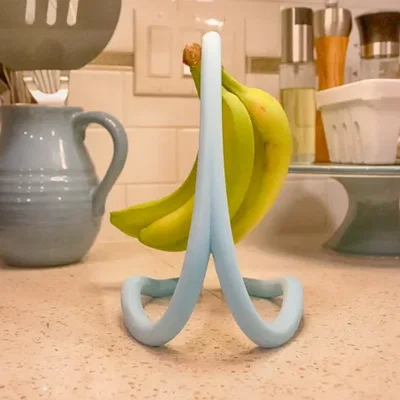 FlowFrame Banana Cradle - Kệ treo chuối nghệ thuật hiện đại