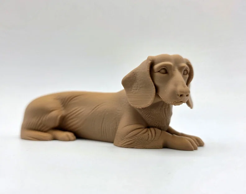 Tượng chó Dachshund lông ngắn đang nằm - Image 1