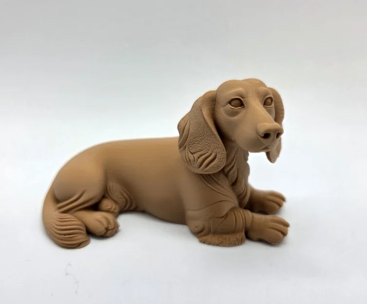 Mô hình chú chó Dachshund lông dài đang nằm - Image 1