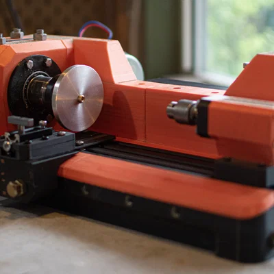 Open Lathe V1: Máy tiện tự chế bằng in 3D kết hợp bê tông