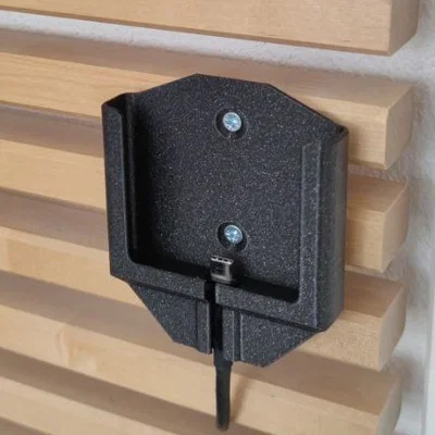 Giá đỡ điện thoại treo tường thông minh tích hợp khe sạc tiện lợi