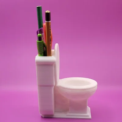 Ống cắm bút hình bồn cầu (Toilet Pencil Cup) độc lạ cho bàn làm việc