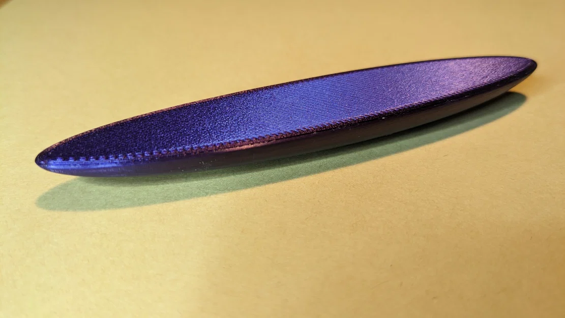 Rattleback (Anagyre) – Đồ chơi quay một chiều - Image 1