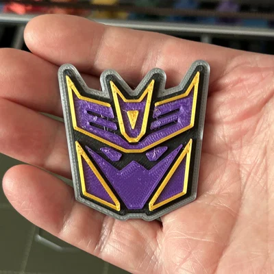 Huy hiệu & Móc khóa Transformers Megatronus Prime