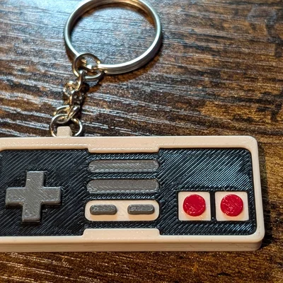 Móc khóa tay cầm NES in 3D phong cách retro hoài niệm