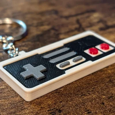 Móc khóa tay cầm NES in 3D phong cách retro hoài niệm