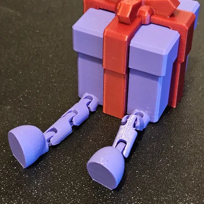 Hộp quà trang trí Giáng sinh với chân cử động linh hoạt