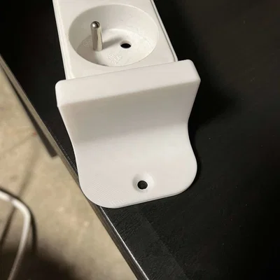 Držák na prodlužovací kabel (Giá đỡ dây nối dài)