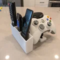 Giá Đỡ Remote & Tay Cầm Đa Năng Kèm Khay Pin AA V6 - Thumbnail 1