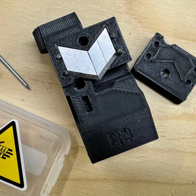 Bộ chọn MMU3 cải tiến với chốt kim loại giữ lưỡi cắt filament