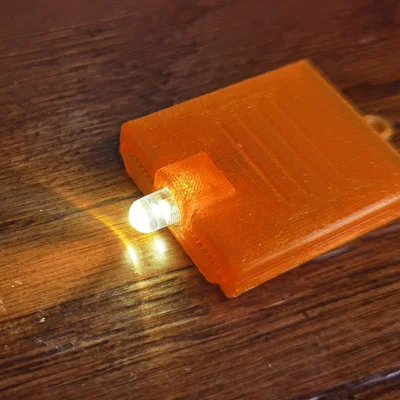 Móc khóa đèn LED siêu nhỏ gọn dùng pin 2032