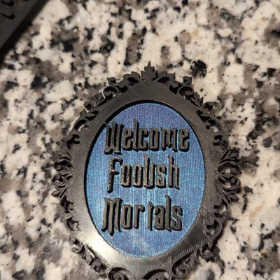 Nam châm tủ lạnh Disney Haunted Mansion “Welcome Foolish Mortal”