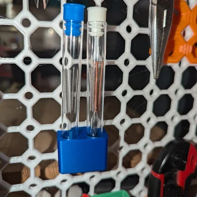 Giá treo ống đựng kim thông nozzle trên hệ thống Multiboard