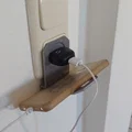Giá đỡ điện thoại gắn ổ cắm sạc tiện lợi - Thiết kế 3D thông minh - Thumbnail 1